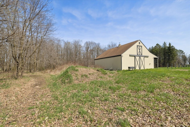 view of yard featuring an outbuilding and an outdoor structure