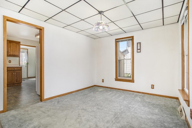 spare room with carpet floors and baseboards