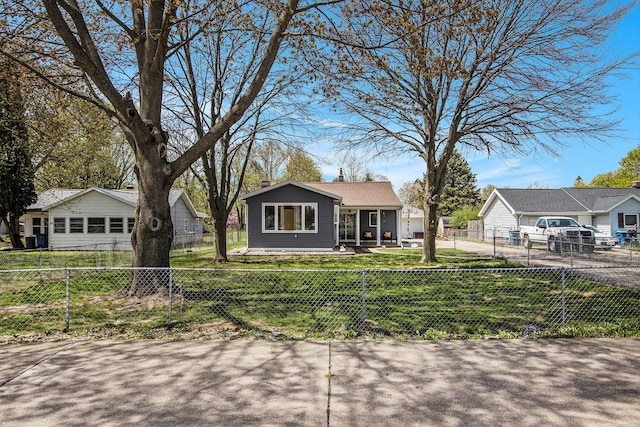 bungalow-style house featuring fence private yard and a front yard