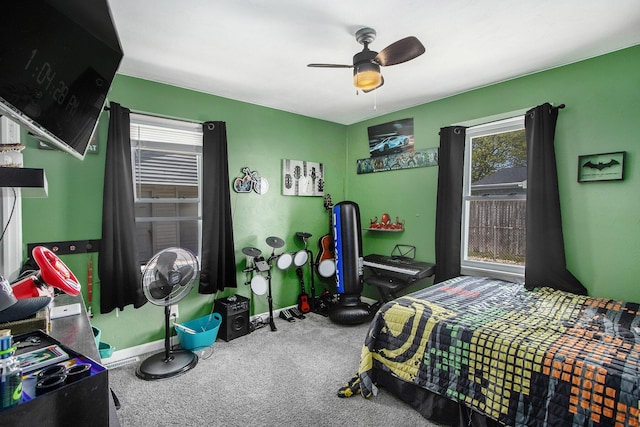 bedroom featuring baseboards, a ceiling fan, and carpet