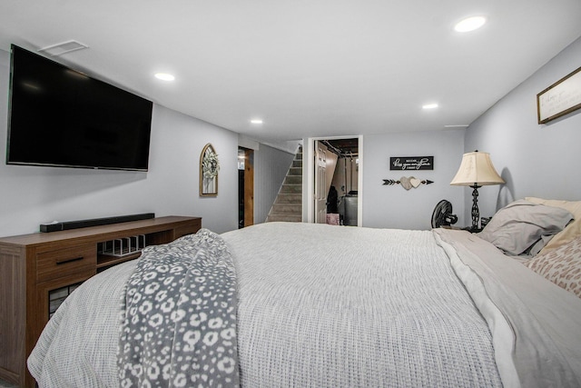 bedroom with recessed lighting, a walk in closet, and a closet