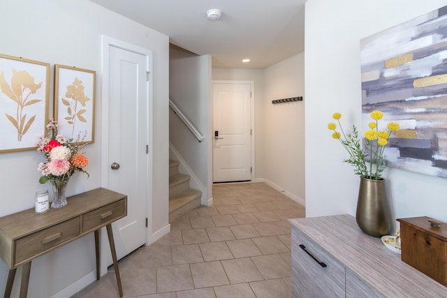 2841 Hardwick Rd, Ann Arbor, MI 48105 - interior space featuring recessed lighting, baseboards, light tile patterned floors, and stairway