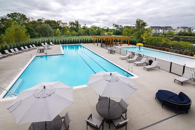 2841 Hardwick Rd, Ann Arbor, MI 48105 - community pool featuring a pergola, fence, and a patio
