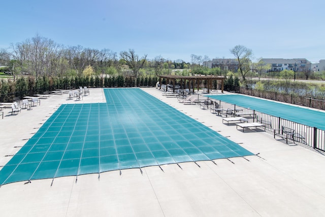 2841 Hardwick Rd, Ann Arbor, MI 48105 - pool with fence, a pergola, and a patio area