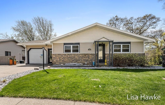 view of front facade with concrete driveway, brick siding, a front yard, and a garage