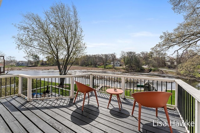 wooden terrace with a water view