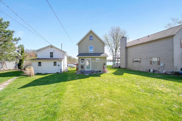 5576 Rays Dr, Onsted, MI 49265 - rear view of property featuring a yard
