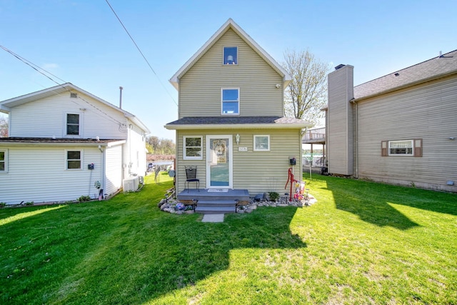 5576 Rays Dr, Onsted, MI 49265 - back of property featuring central AC unit and a yard