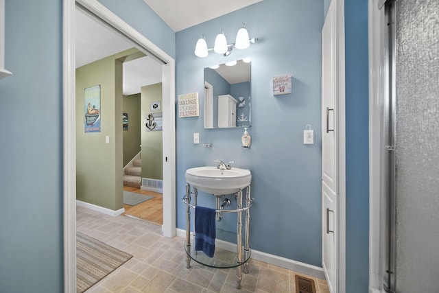 5576 Rays Dr, Onsted, MI 49265 - bathroom with visible vents and baseboards