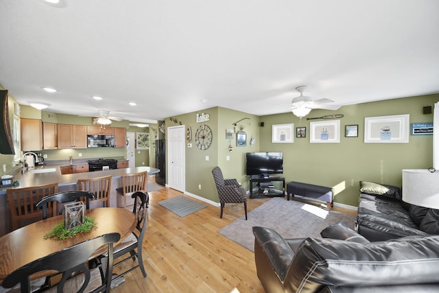 5576 Rays Dr, Onsted, MI 49265 - living room with a ceiling fan, baseboards, recessed lighting, and light wood-style flooring