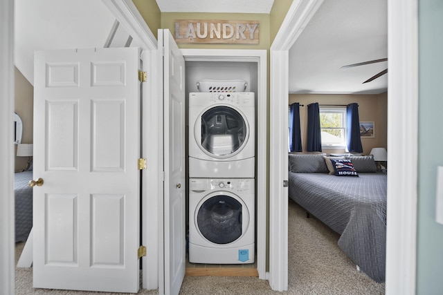 5576 Rays Dr, Onsted, MI 49265 - washroom with carpet floors, stacked washer and clothes dryer, a ceiling fan, and laundry area