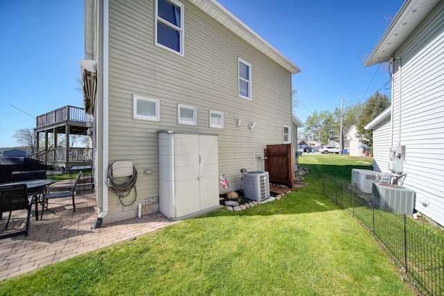 5576 Rays Dr, Onsted, MI 49265 - back of property with fence, a patio, a lawn, and cooling unit