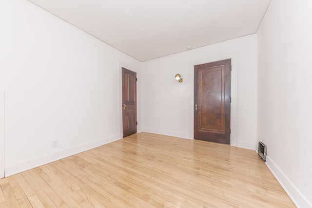 1324 Wells St, Ann Arbor, MI 48104 - unfurnished room with light wood-style floors, baseboards, and visible vents