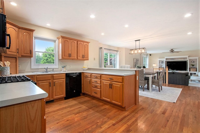 2191 W Linco Rd, Stevensville, MI 49127 - kitchen with dishwasher, light wood finished floors, open floor plan, a peninsula, and recessed lighting