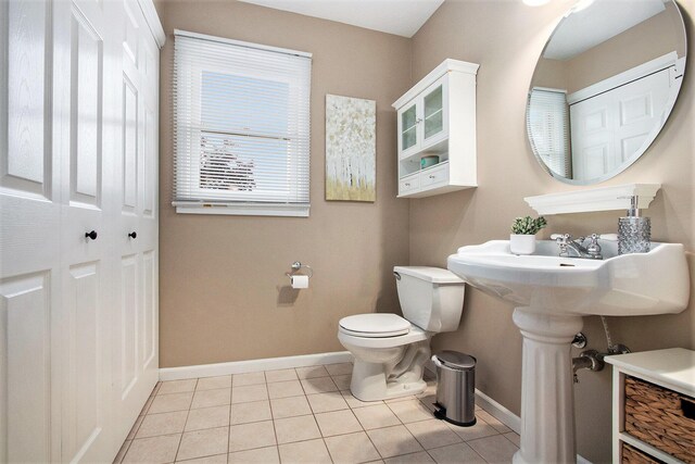 2191 W Linco Rd, Stevensville, MI 49127 - half bath with baseboards, tile patterned flooring, and toilet