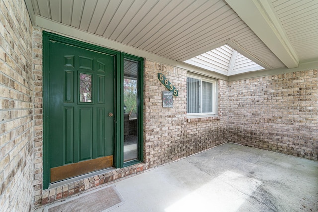 entrance to property with brick siding