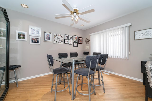 dining room featuring recessed lighting, baseboards, a ceiling fan, and light wood-type flooring