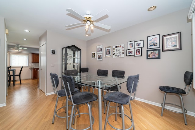 dining area featuring recessed lighting, baseboards, a ceiling fan, and light wood finished floors