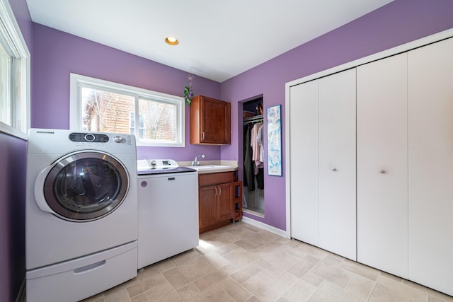 washroom featuring a sink, cabinet space, recessed lighting, and independent washer and dryer