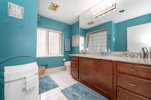 bathroom featuring vanity, toilet, tile patterned floors, baseboards, and a shower with curtain