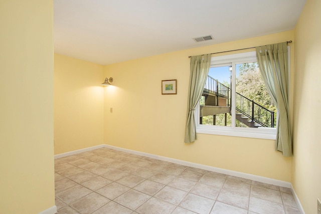 2347 W W Dowling Rd, Delton, MI 49046 - spare room with baseboards and light tile patterned flooring