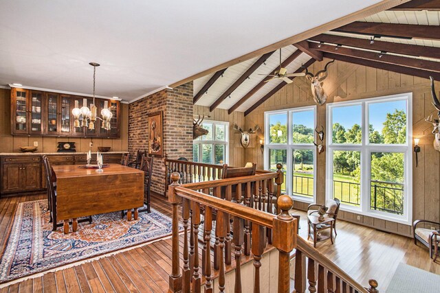 2347 W W Dowling Rd, Delton, MI 49046 - interior space with hardwood / wood-style flooring, a chandelier, and wood walls