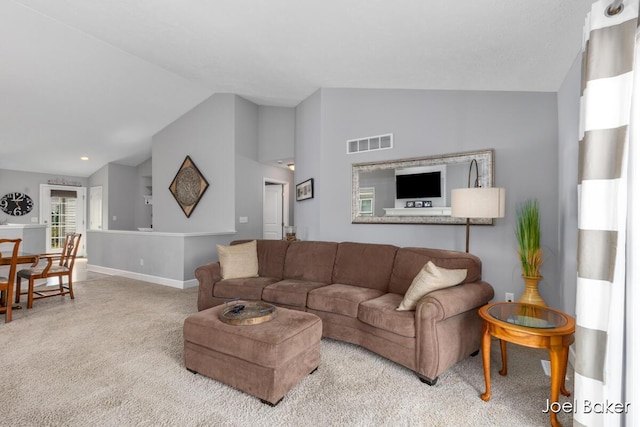 living area with visible vents, baseboards, carpet, and lofted ceiling