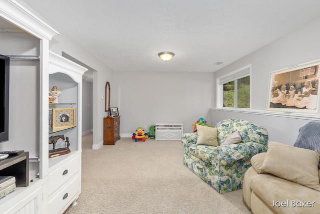 living area featuring carpet flooring