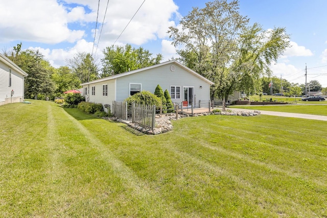 220 Nottingham Dr, Brooklyn, MI 49230 - view of side of property featuring a yard and a patio area