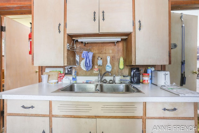 69 W 13th St, Holland, MI 49423 - kitchen featuring a sink and light countertops