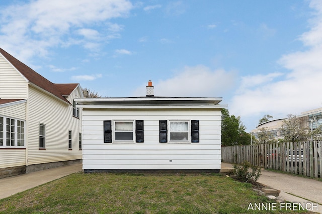 69 W 13th St, Holland, MI 49423 - view of home's exterior with a chimney