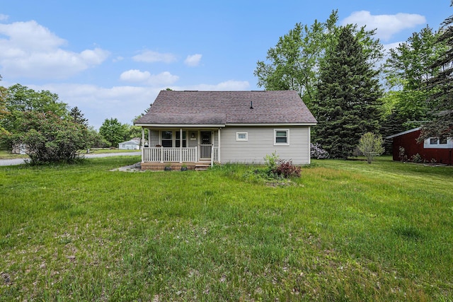 14770 Panu Ave, Kaleva, MI 49645 - rear view of property featuring covered porch, a lawn, and roof with shingles