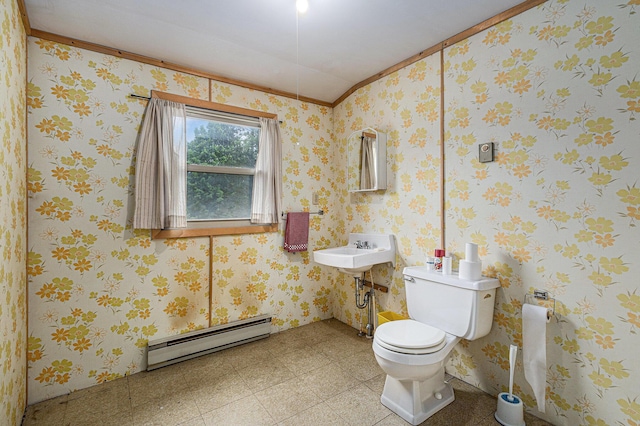 14770 Panu Ave, Kaleva, MI 49645 - half bathroom with a baseboard heating unit, ornamental molding, toilet, a sink, and tile patterned floors