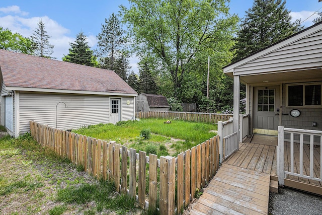 14770 Panu Ave, Kaleva, MI 49645 - wooden deck with a fenced backyard and an outdoor structure