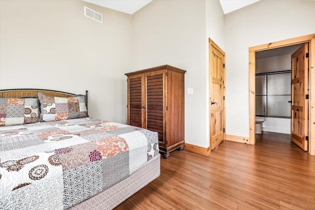 80220 Linden Hills St, Covert, MI 49043 - bedroom with baseboards, light wood finished floors, and a towering ceiling