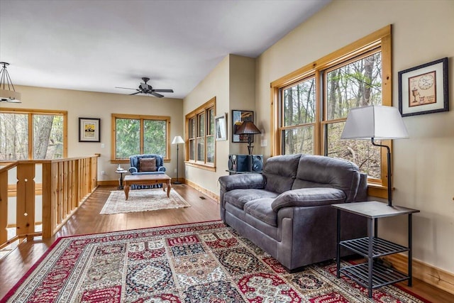 80220 Linden Hills St, Covert, MI 49043 - living room with wood finished floors, a ceiling fan, and baseboards