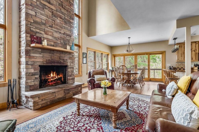 80220 Linden Hills St, Covert, MI 49043 - living area featuring wood finished floors, a fireplace, and baseboards