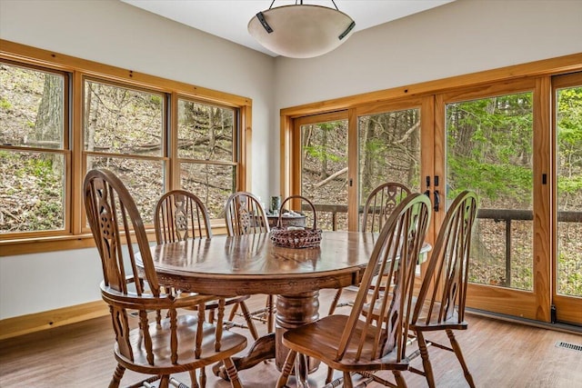 80220 Linden Hills St, Covert, MI 49043 - dining room with light wood-style flooring, healthy amount of natural light, and baseboards