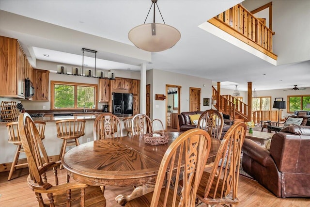 80220 Linden Hills St, Covert, MI 49043 - dining room with stairway, light wood-style floors, healthy amount of natural light, and ceiling fan