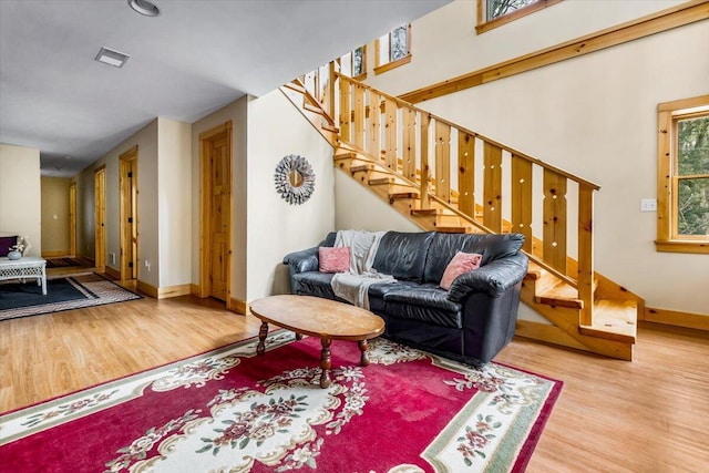 80220 Linden Hills St, Covert, MI 49043 - living area featuring wood finished floors, stairway, and baseboards