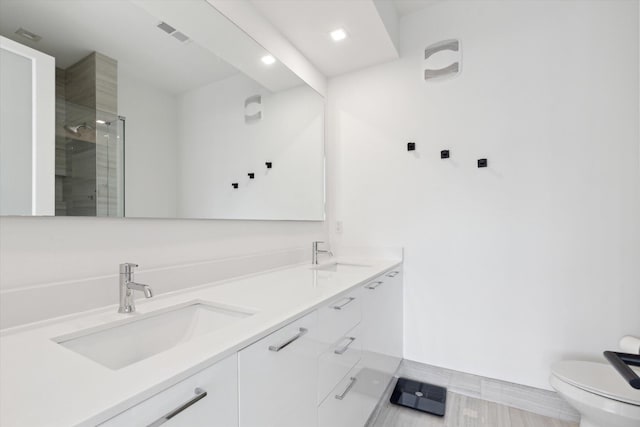 533 E Harrison Unit 3, Royal Oak, MI 48067 - full bath with a sink, a shower stall, toilet, and visible vents