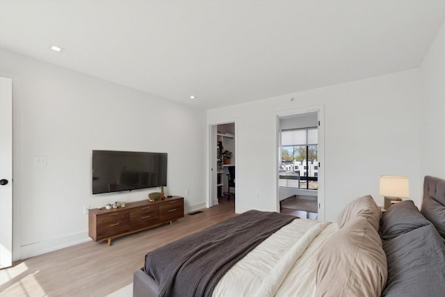 533 E Harrison Unit 3, Royal Oak, MI 48067 - bedroom with baseboards, a closet, a spacious closet, light wood-style floors, and recessed lighting