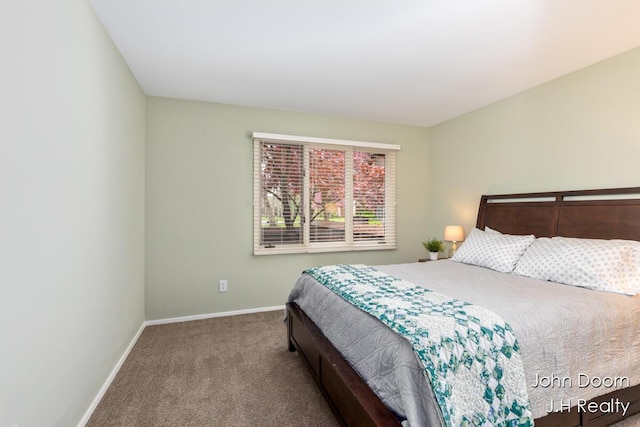bedroom with carpet flooring and baseboards
