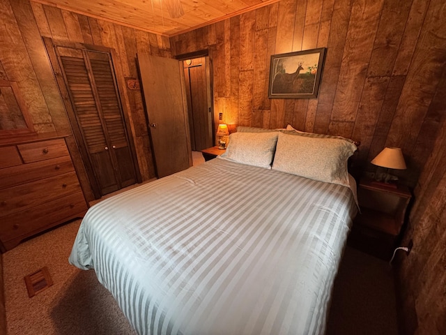 3574 N Comanche Trl, Branch, MI 49402 - bedroom with wooden walls, wood ceiling, and a closet