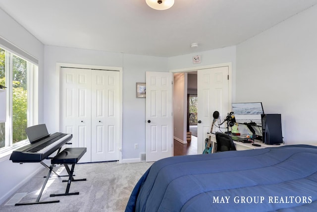 3729 Windshire Dr SE, Grand Rapids, MI 49546 - carpeted bedroom with baseboards, a closet, and a desk