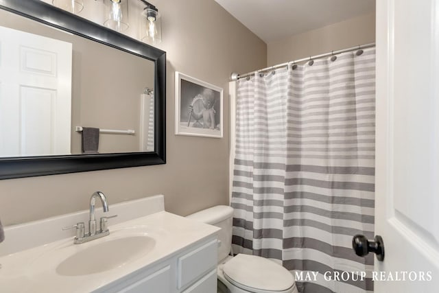 3729 Windshire Dr SE, Grand Rapids, MI 49546 - bathroom featuring toilet, vanity, and a shower with curtain