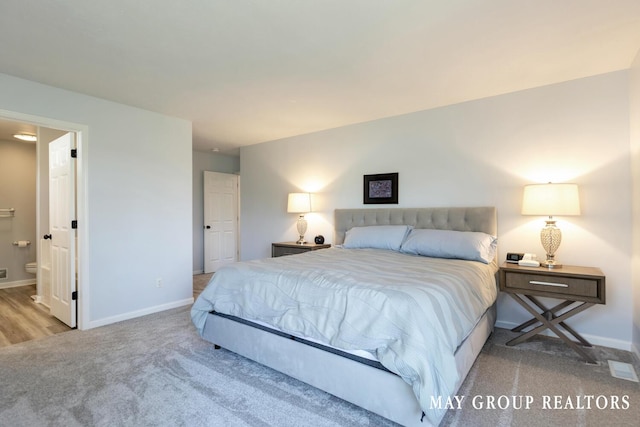 3729 Windshire Dr SE, Grand Rapids, MI 49546 - carpeted bedroom featuring baseboards and ensuite bathroom