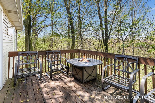 3729 Windshire Dr SE, Grand Rapids, MI 49546 - deck with an outdoor fire pit