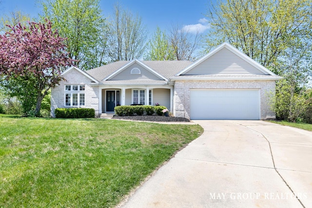 3729 Windshire Dr SE, Grand Rapids, MI 49546 - ranch-style home featuring an attached garage, a front yard, driveway, and covered porch