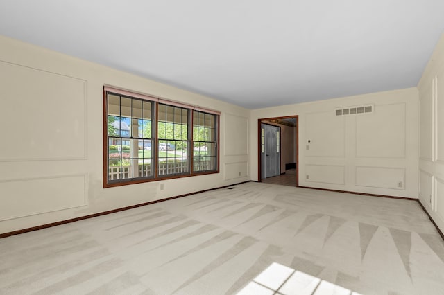 275 S Bluffwood Ter, Saint Joseph, MI 49085 - spare room featuring a decorative wall and light carpet